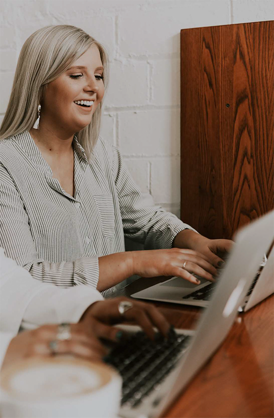 Happy woman on a laptop